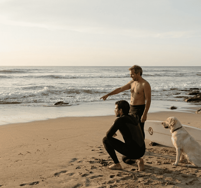 Two surfer observing the waves